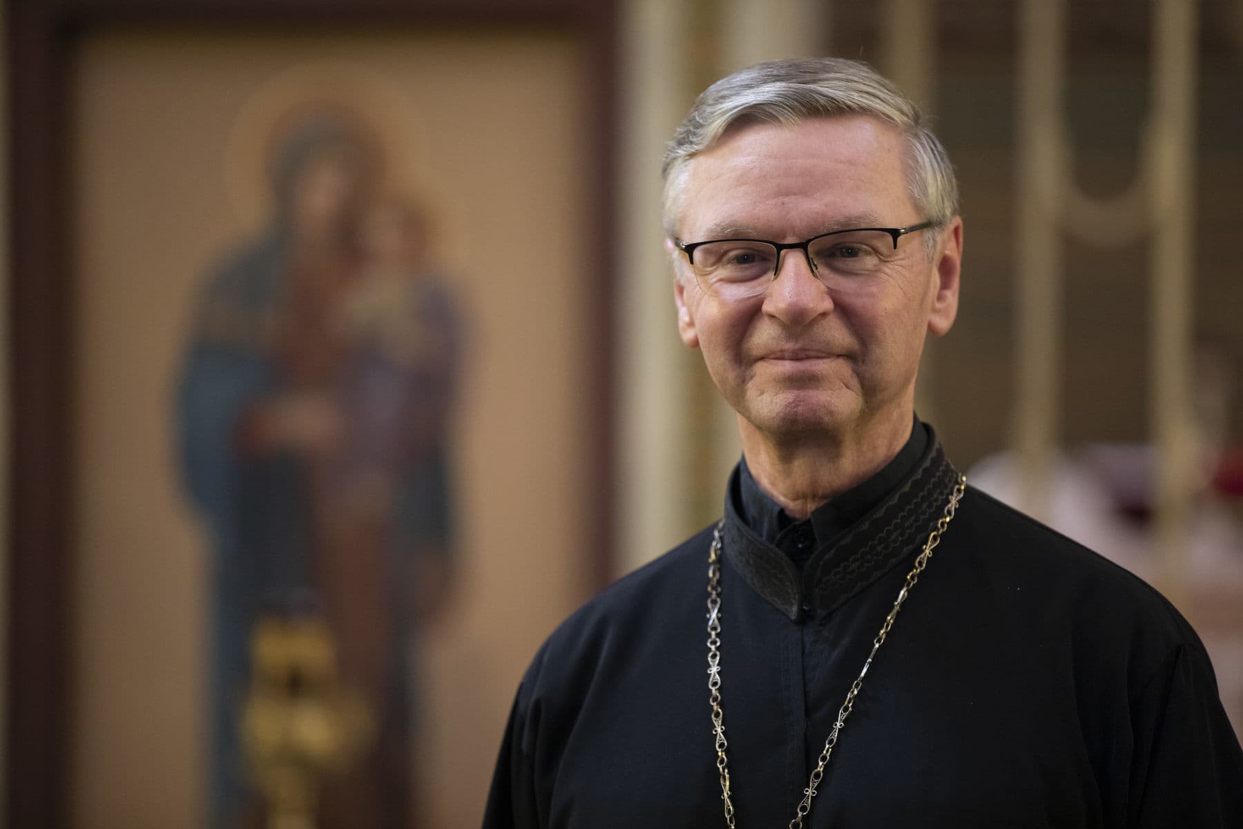 Bishop David Motiuk wearing black clerical vestments.